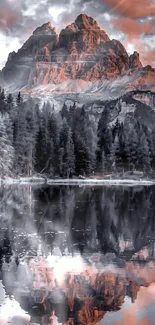 Majestic mountain reflecting in serene lake at dawn.