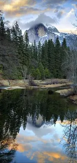 Serene mountain reflection in calm lake with vibrant sky.