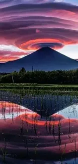 Majestic mountain reflected in lake with stunning sunset colors.