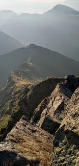 Stunning mountain ridge with misty view and distant peaks.