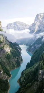 A stunning mountain valley with a winding river and cloudy sky on a mobile wallpaper.