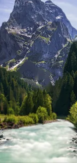 Majestic mountain with river and lush forest in vibrant wallpaper.