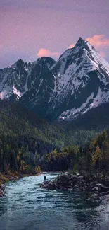 Scenic view of a river with majestic snow-capped mountains and a colorful sky.