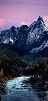 Stunning purple sunset over a snow-capped mountain and river.