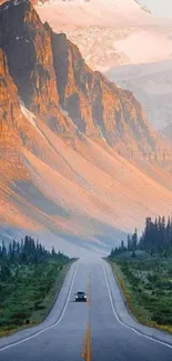 Majestic mountain road with orange cliffs and lush greenery.