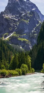 Serene mountain stream with lush forest and towering peaks.