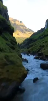 Breathtaking view of a mountain stream flowing through lush green valleys.