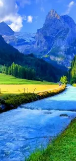 Serene mountain stream with lush green valley and towering peaks.