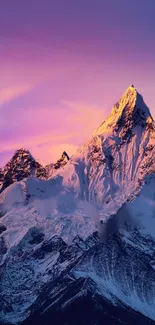 Majestic mountain at sunset with vibrant colors illuminating the snowy peaks.