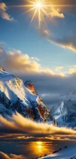 Golden sunset over snowy mountain peaks with a serene sky.