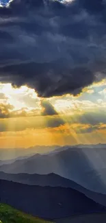 Dramatic sunset over mountains with sunrays.