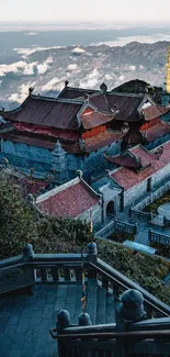 Majestic mountain temple with red rooftops in a lush landscape.