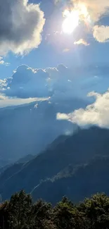 Beautiful mountain view with clouds and sunlight in a serene nature wallpaper.