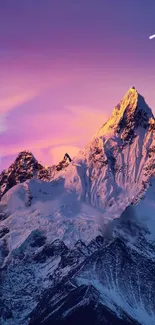 A sunset view of a snow-capped mountain with a purple sky and a shooting star.