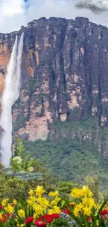 Majestic mountain with waterfall and vibrant flowers in foreground.