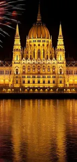 Nighttime fireworks above illuminated building with reflective water.