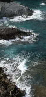 Rocky cliffs and turquoise shoreline with waves crashing gently.