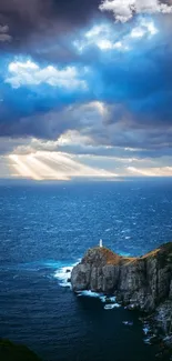 Lighthouse on a cliff with dramatic ocean view and sun rays piercing through clouds.