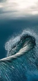 Majestic ocean wave with deep blue hues under a dramatic sky.