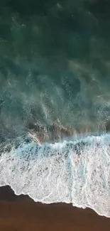 Aerial view of majestic ocean waves on a mobile phone wallpaper.