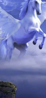 White Pegasus flying through mystical blue sky above clouds.