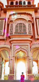 Majestic pink palace with intricate details and archways, perfect for mobile wallpaper.