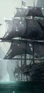 A majestic pirate ship sails through misty ocean cliffs.