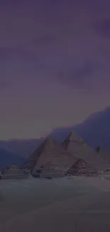 Pyramids at dusk in a serene twilight setting with purple sky.