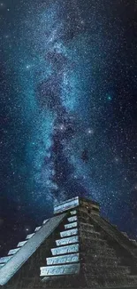 Majestic starry sky above an ancient pyramid at night.