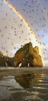 Golden cliffs with rainbow and raindrops on beach.