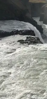 Scenic waterfall cascading through rocky landscape.