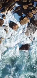 Aerial view of ocean waves crashing against rugged rocks.