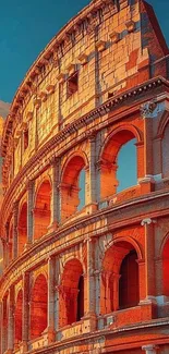 Roman Colosseum at sunrise with vibrant orange sky.