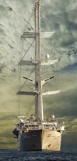 Majestic sailboat navigating the open sea under a dramatic sky.