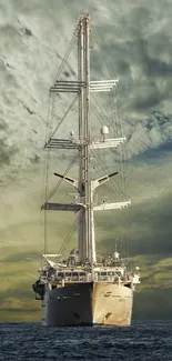 Majestic ship sailing under a dramatic sky on the ocean blue wallpaper.