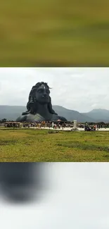 Majestic Shiva statue in serene landscape with lush greenery.