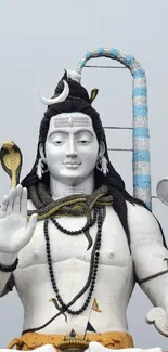 Majestic Shiva statue in serene setting.