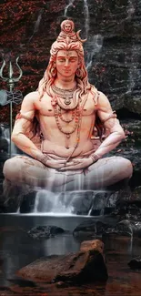 Shiva statue meditation with waterfall backdrop.