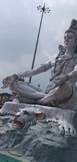 Majestic Shiva statue in a serene outdoor setting.