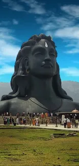 Majestic Shiva statue with clear blue sky background.