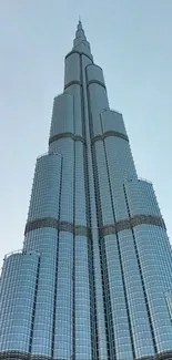 Majestic skyscraper against a clear blue sky.