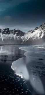 Snowy mountain landscape with coast and blue sky, perfect for winter wallpaper.