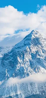 Majestic snowy mountain with a blue sky backdrop.