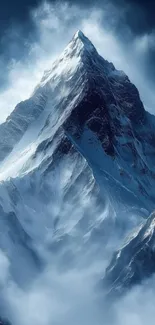 Majestic snowy mountain peak under blue sky.