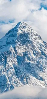 Majestic snowy mountain peak with bright blue sky backdrop.