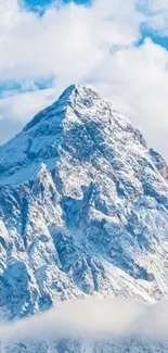 Snowy mountain peak under a bright blue sky.