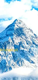 Snowy mountain peak under bright blue sky.