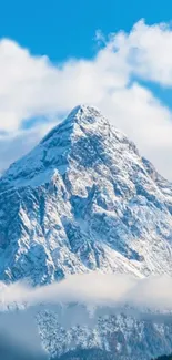 Snowy mountain peaks beneath a blue sky.