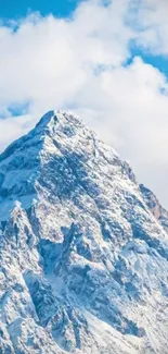 Majestic snowy mountain under a vibrant blue sky.