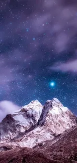 Starry night sky over majestic mountain peaks.